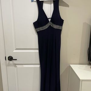 Navy blue gown with beaded strap around the bust